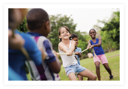 A group of kids playing tug-a-war